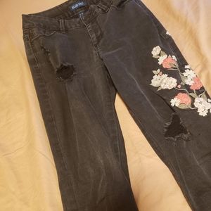embroidered black distressed denim jeans